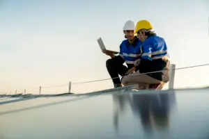 Specialist Technician Professional Engineer With Laptop Tablet Maintenance Checking Installing Solar Roof Panel Factory Rooftop Sunlight Engineers Team Survey Check Solar Panel Roof