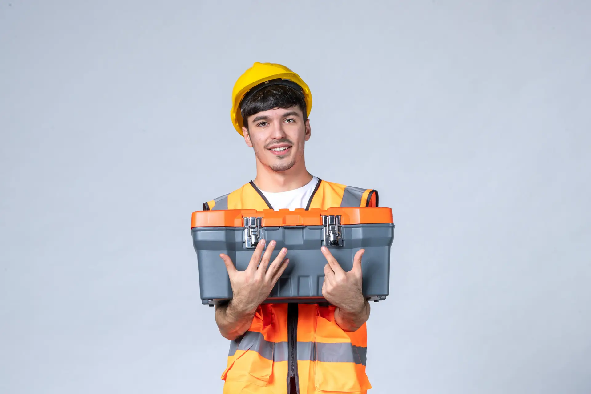 Repair Vs. Replace Commercial Roof: Nyc Property Owners Guide 2 Front View Young Male Worker With Tool Case White Background Scaled